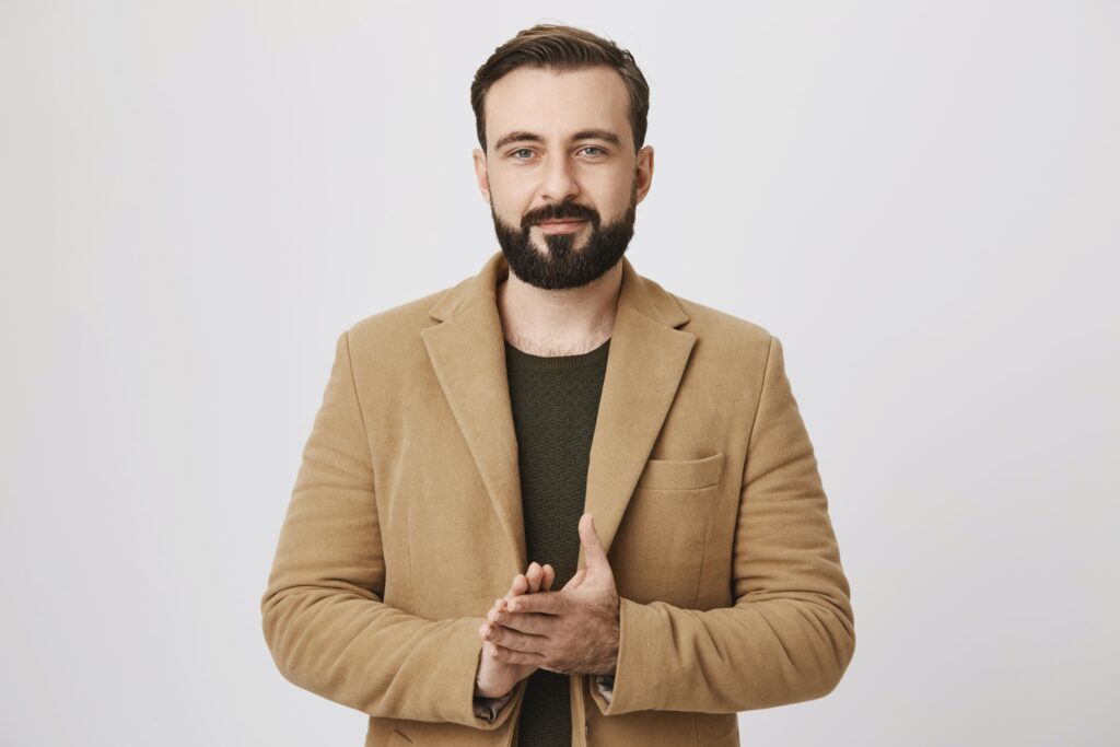 handsome-bearded-businessman-rubbing-hands-having-deal-1-1